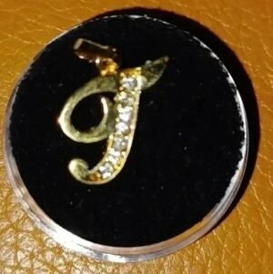 Gold plated letter pendant "J" with faux diamonds